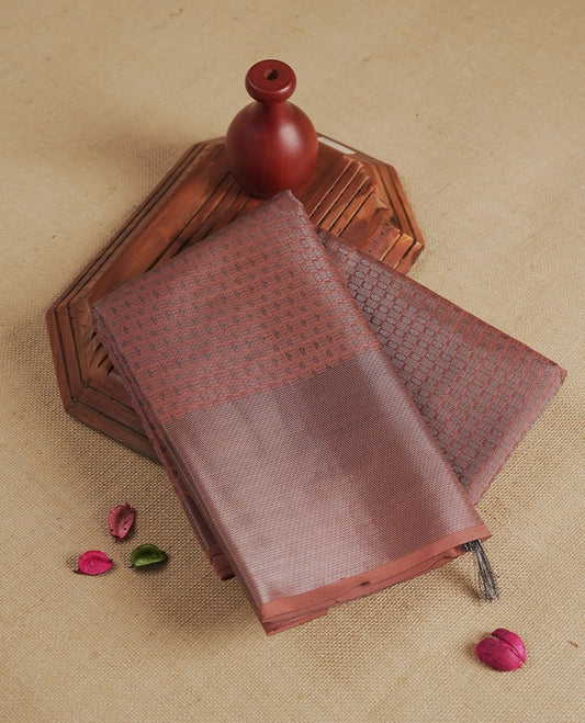 Amber brown colour semi silk saree featuring neem zari Brocade Pattern all over the body, complemented by a Self Colour woven border with detailing, Pallu & blouse.