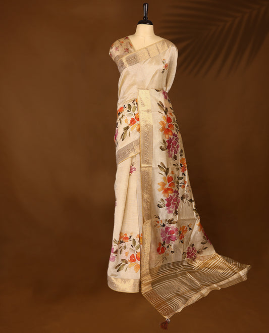 Ivory tussar Kerala saree adorned with intricate floral Digital Prints, complemented by a rich zari border, detailed pallu with matching Blouse