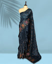 Midnight Blue Colour crush soft silk saree, textured body with a natural crinkled finish, adorned with intricate Multi colored floral Motifs and complemented by a delicate Multi Colour Bold Floral embroidery border, paired with a matching blouse