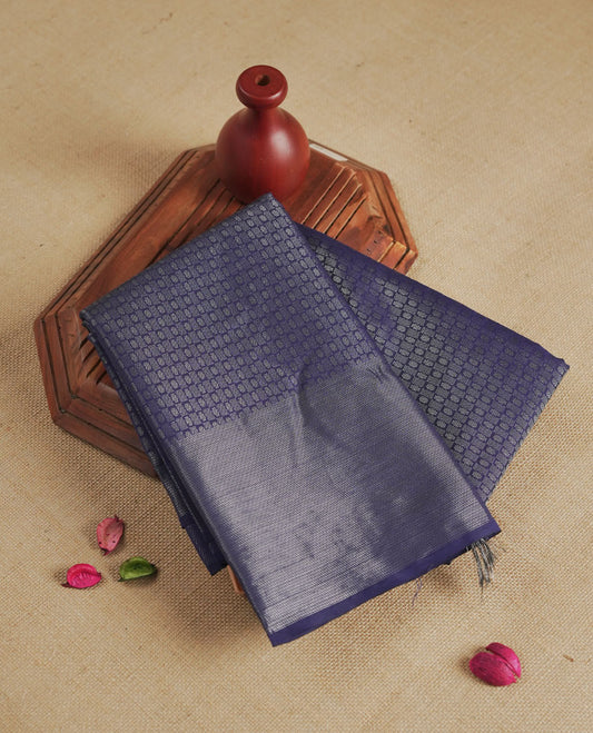 Navy blue colour semi silk saree featuring neem zari Brocade Pattern all over the body, complemented by a Self Colour woven border with detailing, Pallu & blouse.