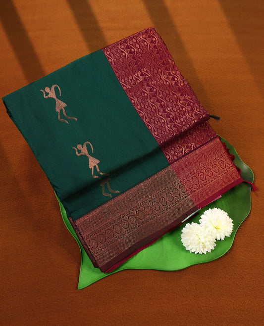 Bottle Green and Maroon Kalyani cotton saree featuring elegant dancing figure motifs on the body, complemented with a richly woven zari border and pallu in maroon, paired with a matching blouse.