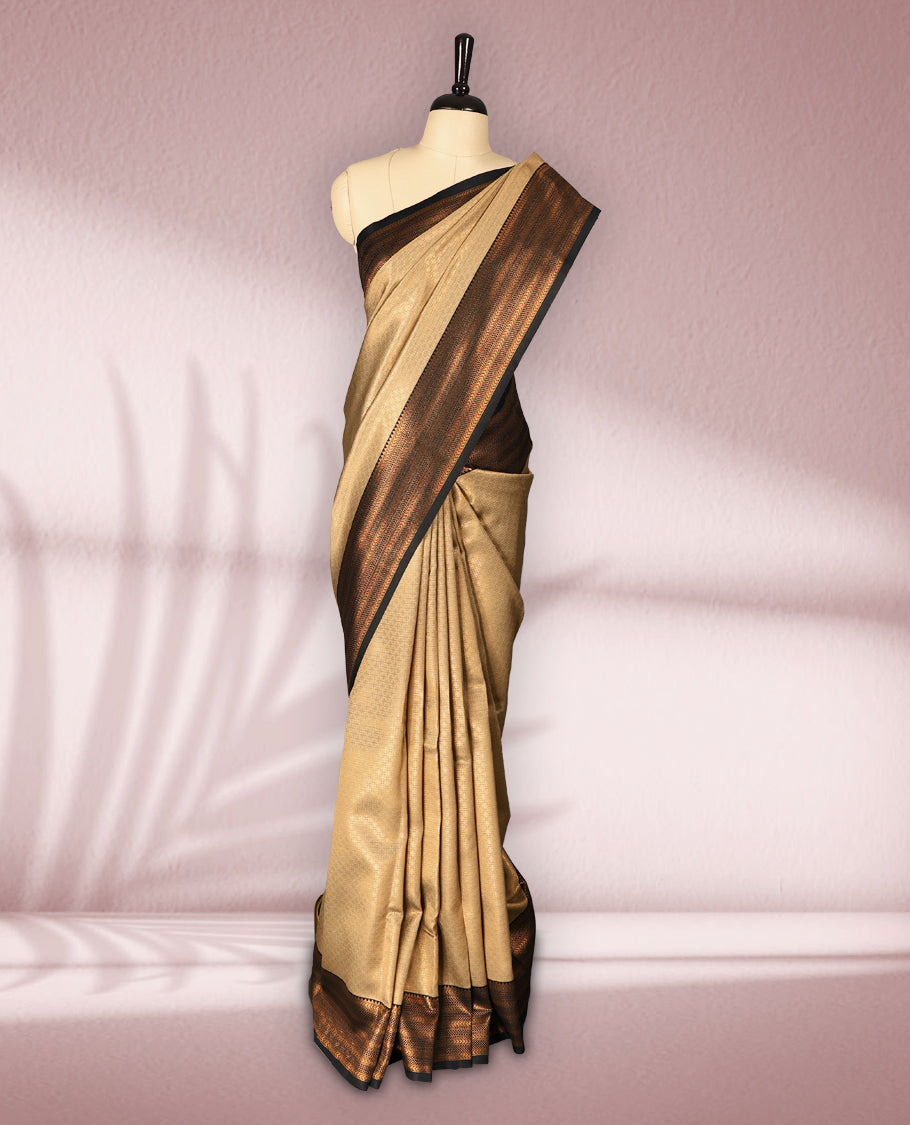 Beige colour semi silk brocade saree featuring intricate gold zari woven patterns across the body, paired with a rich Black and gold zari woven border in traditional motifs, with matching blouse