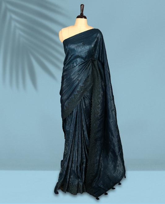 Midnight Blue Colour crush soft silk saree, textured body with a natural crinkled finish, adorned with intricate self colored floral Motifs and complemented by a delicate thread embroidery cutwork border, paired with a matching blouse