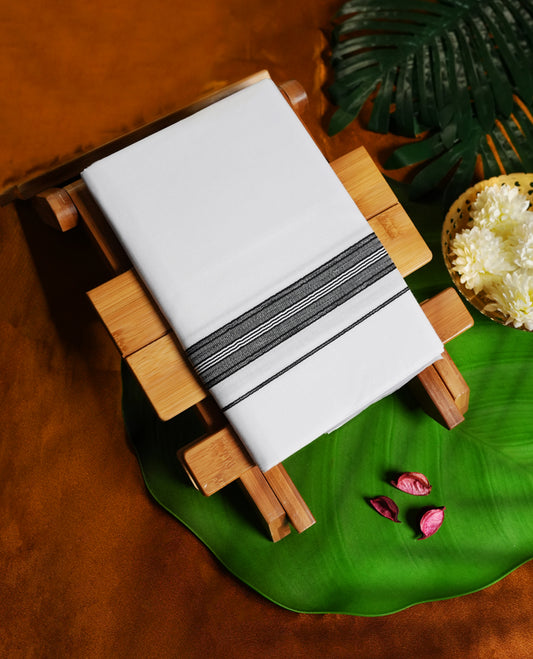 White colour cotton single dhoti featuring a bold black kara with intricate double line detailing, blending traditional elegance with everyday comfort & perfect for rituals, festivals, and cultural events.