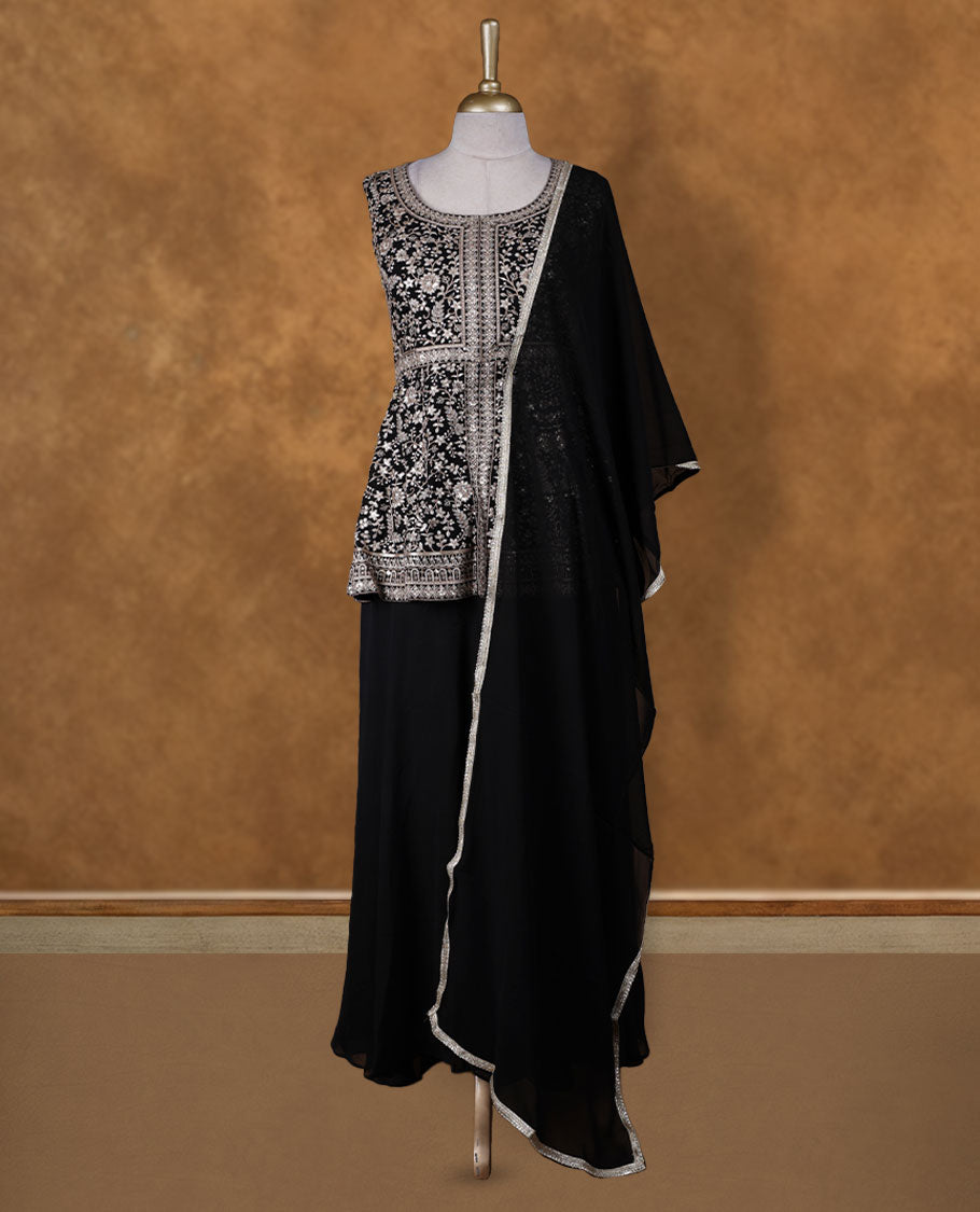 Black colour sharara set adorned with intricate light silver embroidery and sequins work & The fitted embellished top pairs beautifully with the flared bottoms and matching dupatta.