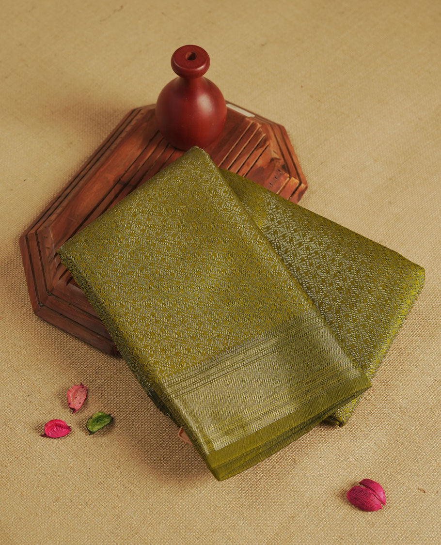Olive colour semi silk saree featuring neem zari Brocade geometric Pattern all over the body, complemented by a Self Colour woven border with detailing, Pallu & blouse.