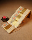 Cream colour Tissue silk set mund Featuring Elegant plain body, Complemented by Floral print with zari border.