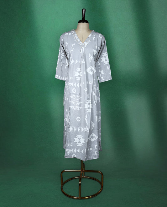 Light grey colour kurti featuring white tribalinspired geometric prints, styled with a V neckline adorned with subtle thread embroidery and 3/4th sleeves ideal for a contemporary ethnic look.