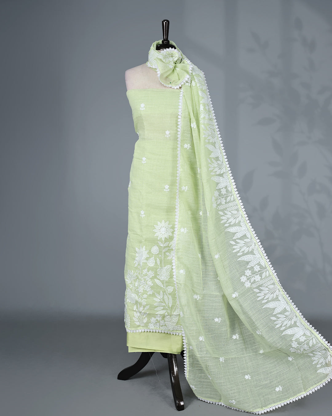 Pastel Lime Green Colour Kotta Net Salwar Material featuring delicate white floral embroidery on the kurta and dupatta, paired with a matching solid bottom for a fresh, elegant, and graceful ethnic look.