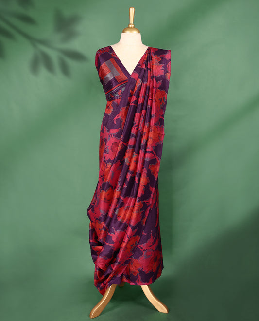 Dark plum colour Manipuri saree featuring oversized crimson and burnt orange floral motifs, finished without a border, and paired with a matching blouse.