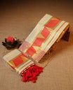 Cream colour Tissue silk set mund Featuring Elegant plain body, Complemented by Temple print on Red colour & gold zari border.