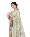 Pastel green colour Semi linen saree featuring vibrant multicolour floral digital prints on body and pallu, paired with a matching blouse.