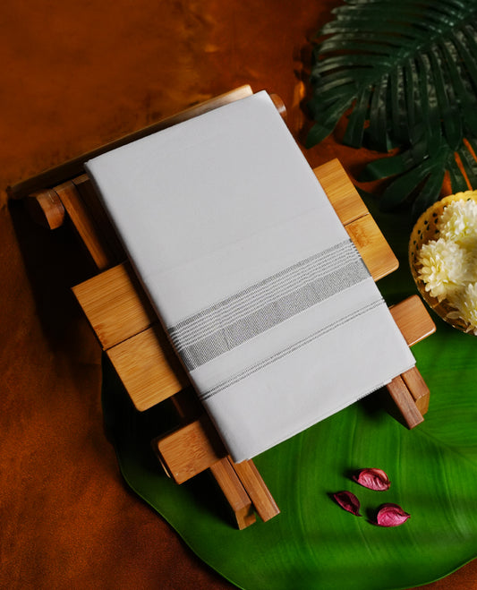 White colour cotton single dhoti featuring a refined silver kara with intricate double line detailing & Designed for daily comfort and traditional grace, ideal for rituals, cultural events, and festive wear.