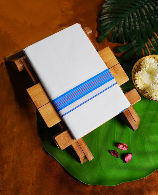 Off white colour cotton single dhoti featuring a vibrant blue kara with fine pink accents and double line detailing & crafted for daily wear and traditional occasions like poojas, festivals, and ceremonies.