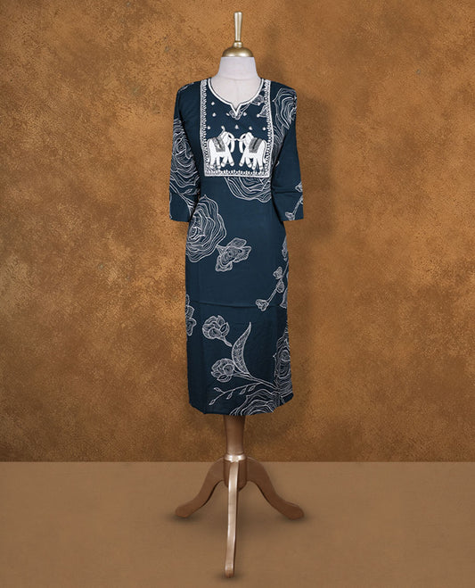Dark Green colour kurti illustrated with bold white floral outlines and an elephant-themed embroidered yoke, styled with a notched neckline and comfy 3/4th sleeves.