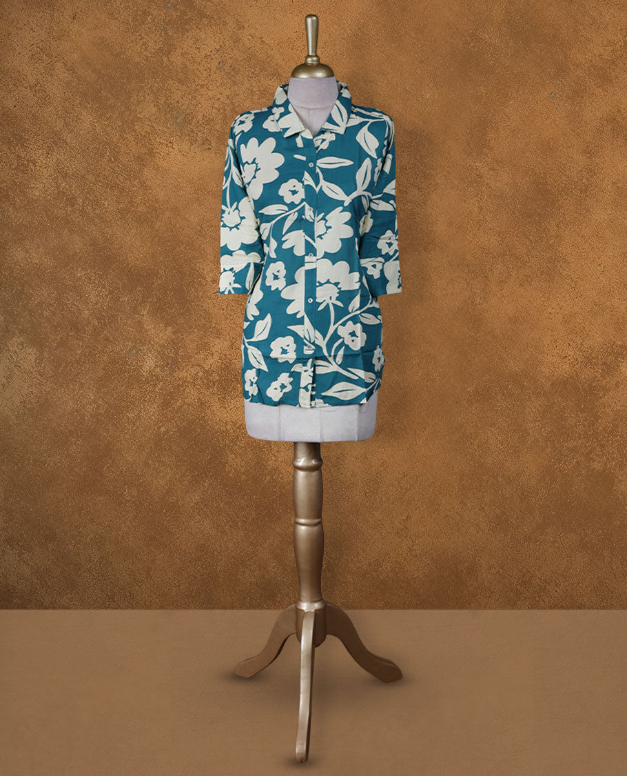 Teal floral printed medium-length kurti with collared neckline, three-quarter sleeves, and front button placket