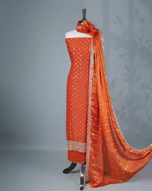 Rust Orange colour salwar material with Cut beats & sequins work on body, Matching Bottom & dupatta.