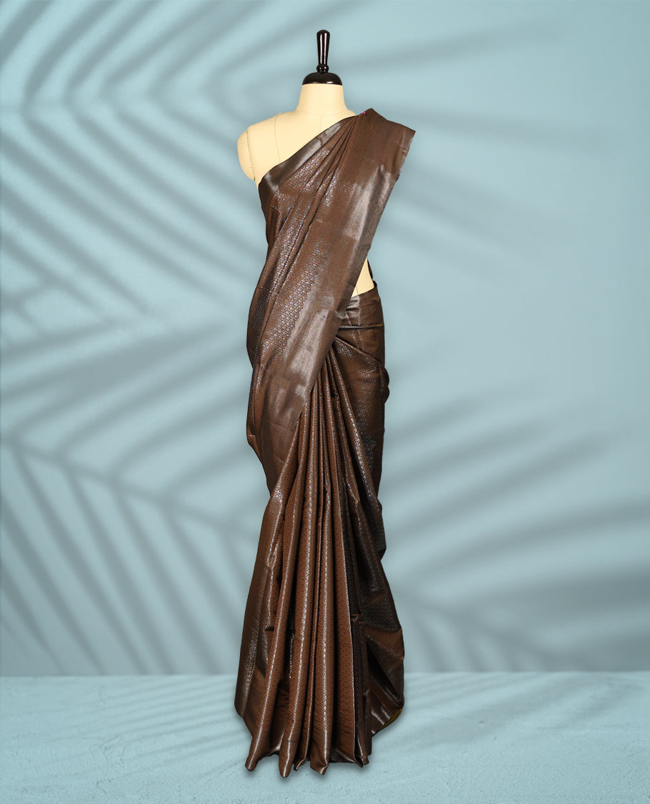 Deep Brown Colour semi silk saree featuring an intricate Zari  motif weave across the body, paired with a zari worked border with matching blouse.