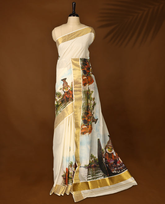Elegant off white Kerala cotton saree featuring Kerala’s traditional cultural and scenic digital prints, beautifully enhanced with a classic golden zari border paired with a matching blouse.