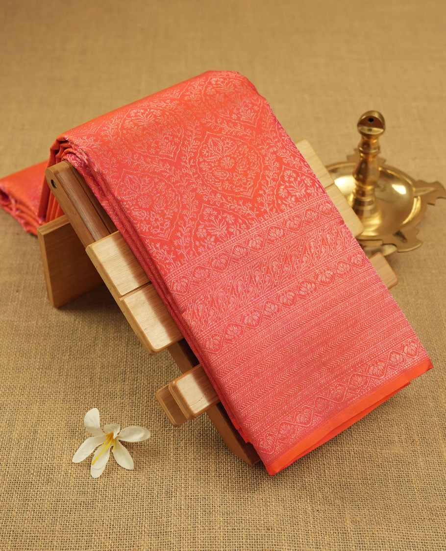 Peach pink colour Kanchipuram pattern Manthrakodi saree featuring diamond and geometric floral zari jacquard weaving design on the body, geometric self zari border and self zari jacquard blouse piece.