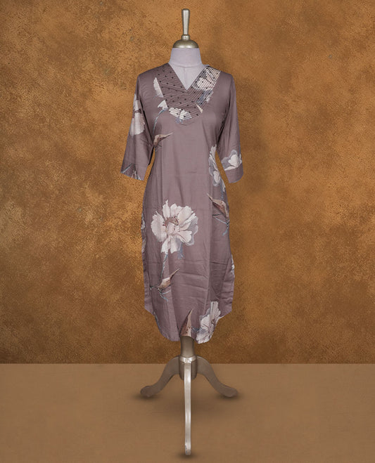 Mauve brown colour kurti BY VISMAY with large floral prints, straight calf length silhouette, styled with a patterned V notch neckline and three quarter sleeves.