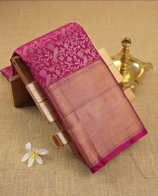 Magenta colour Kanchipuram pattern Manthrakodi saree featuring floral and peacock antique zari jacquard designs, traditional golden zari border and plain blouse piece with border.