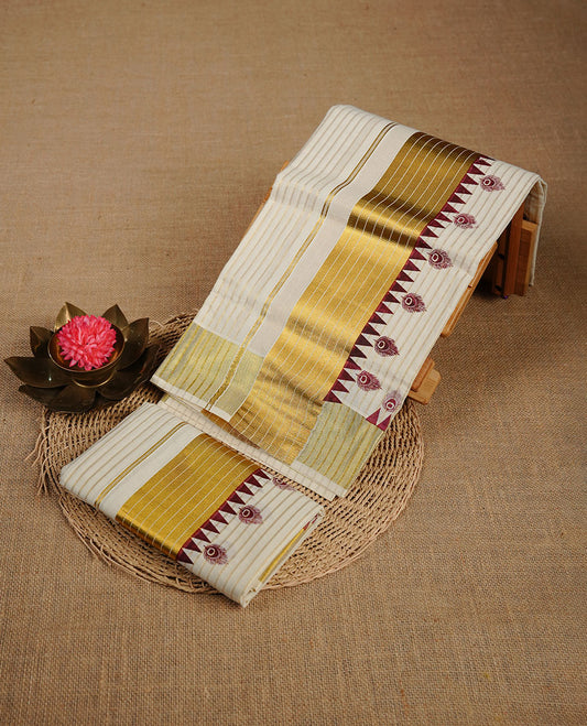 Cream colour cotton set mundu highlighting gold zari stripes on body, border with maroon colour temple & peacock leaf print.