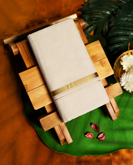 Classic off white colour pure cotton dhoti featuring a subtle golden zari border, combining comfort and tradition, perfect for festive occasions, temple visits, and cultural ceremonies.