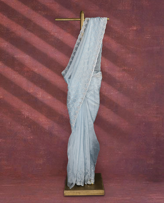 Light Pastel Blue colour pure organza saree featuring sequin work all over the body, adorned with a heavily embellished border with beads, stones, and sequins, complemented by a worked pallu and paired with a matching embellished blouse