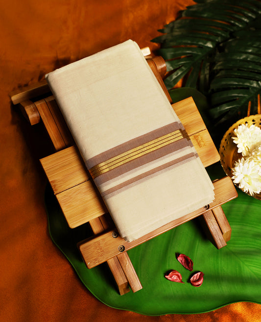 Classic off white colour pure handloom cotton dhoti detailed with a sandal colour border and golden zari stripes, blending tradition and elegance, perfect for weddings, rituals, and festive celebrations.