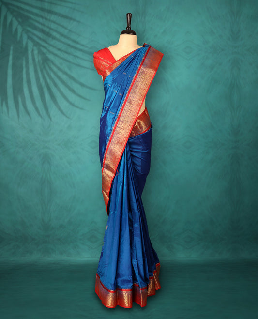 Blue colour Traditional Kancheepuram Silk saree with small gold motifs on body, Rich Red traditional border with intricate gold zari weaving, grand zari pallu, perfect for Bharatanatyam, with matching blouse.