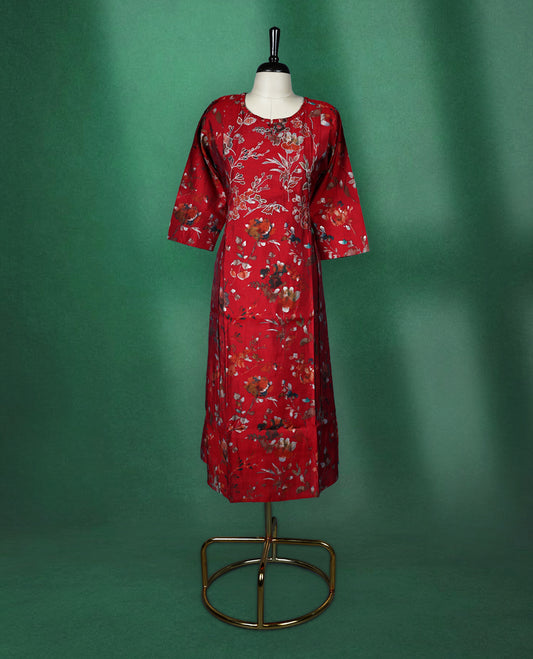 Elegant red kurti with all over floral print, styled with a round neckline, elbow length sleeves, and a straight cut silhouette perfect for casual or semi formal wear.