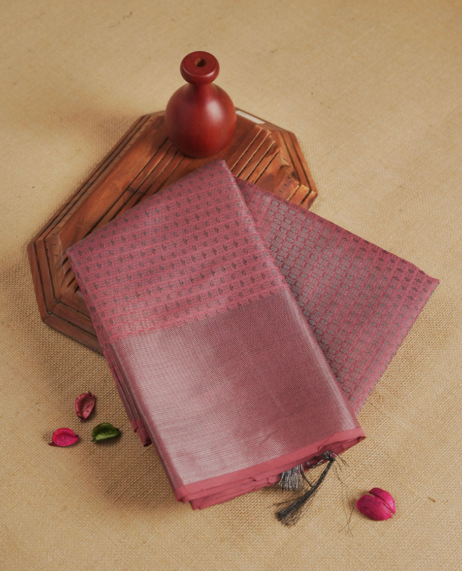 Dusty rose pink colour semi silk saree featuring neem zari Brocade Pattern all over the body, complemented by a Self Colour woven border with detailing, Pallu & blouse.