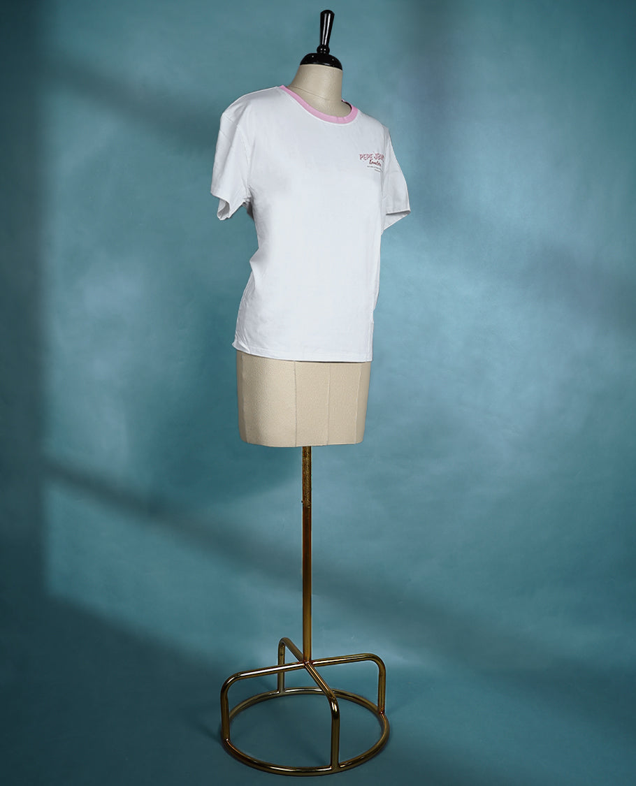 White T shirt with a pink crew neckline, short sleeves, and a front chest print for a casual look.