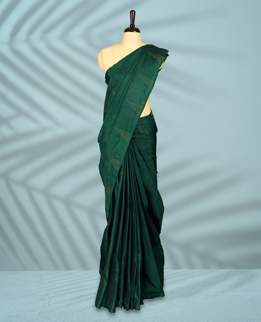 Bottle green Colour semi silk saree features a minimalistic geometric woven body design, a sleek plain border, and comes with a matching blouse.