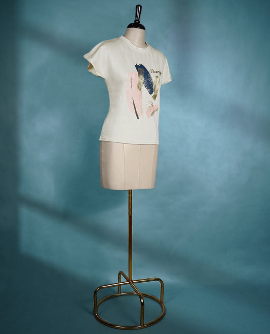 Off white round neck T shirt with short sleeves and a multi colour abstract brushstroke print on the front.