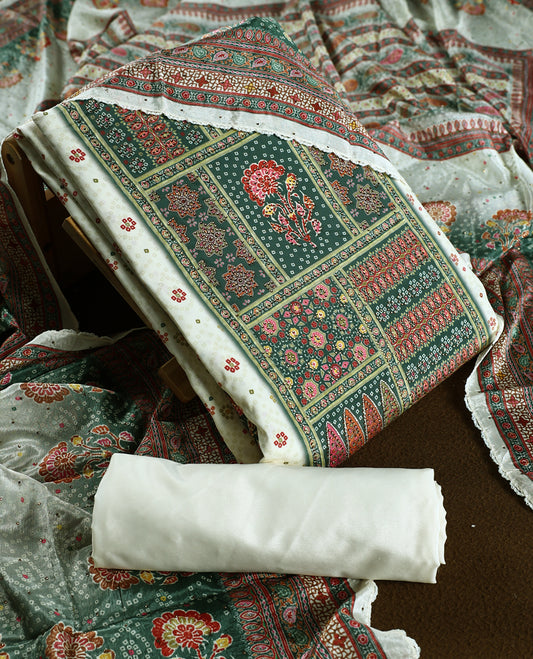 Cream colour churidhar material featuring intricate green colour traditional floral and block prints in red and gold, paired with a plain white bottom and a matching printed dupatta.