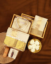 Fawn gold coloured silk wedding shirt, dhoti, and towel set from MINISTER WHITE, embellished with a classic gold zari border, perfect for weddings, festive functions, and traditional occasions.