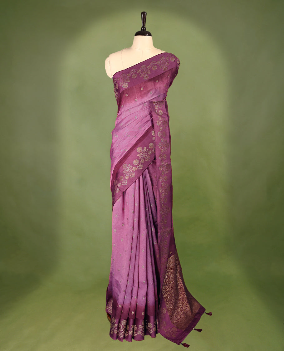 Onion pink and grape wine double shade semi Banaras Tussar Georgette saree adorned with elegant antique gold zari floral motifs across the body, featuring a detailed woven border and grand pallu, paired with a matching blouse piece.