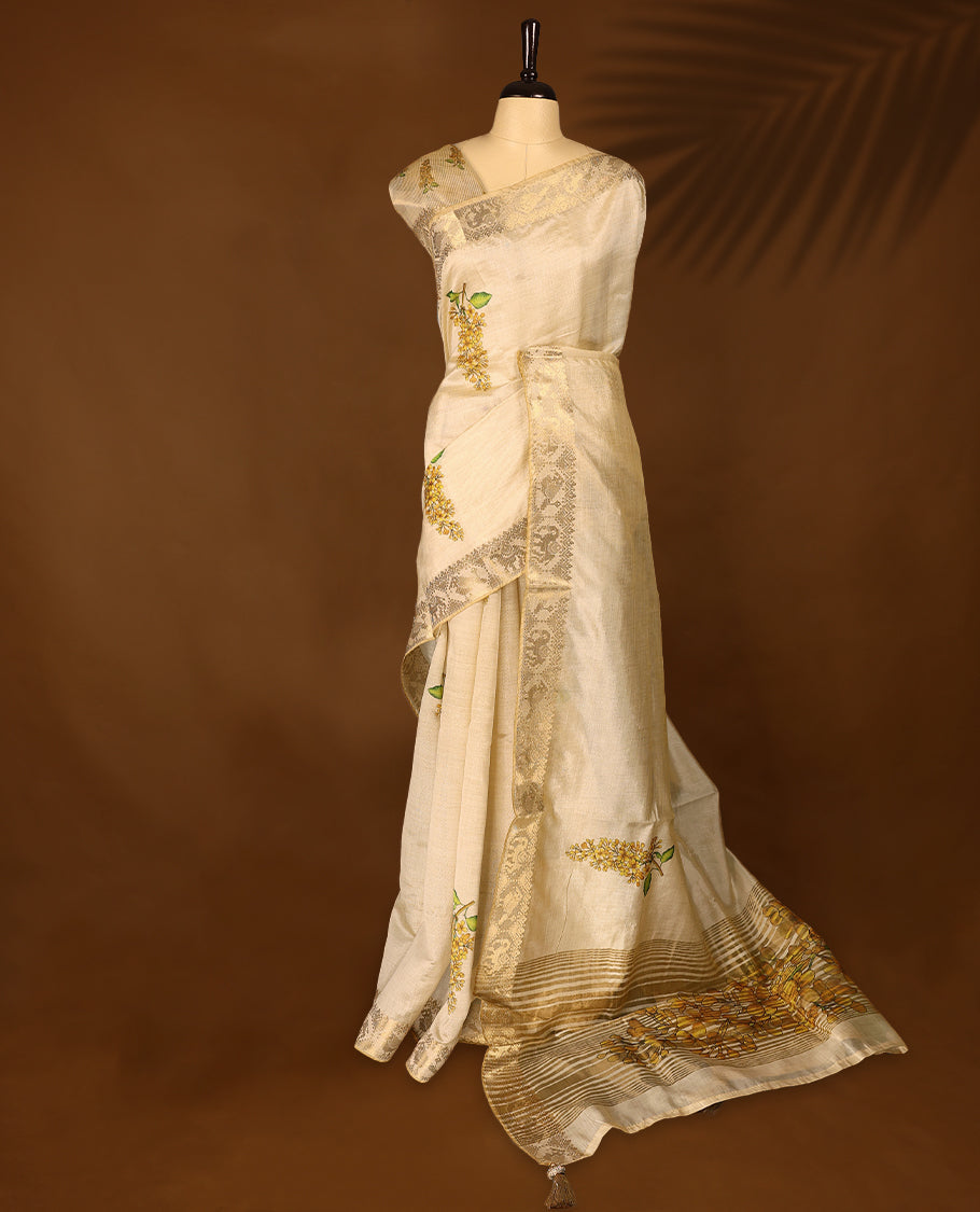 Ivory tussar Kerala saree adorned with intricate floral Digital Prints, complemented by a rich zari border ,detailed pallu and a matching Blouse