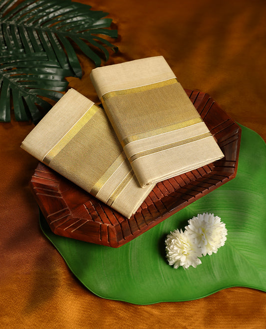 Light Gold colour Tissue SET MUNDU featuring a plain body, complemented by a gold Zari Bold Border ( 2.00/2.80 MTS).