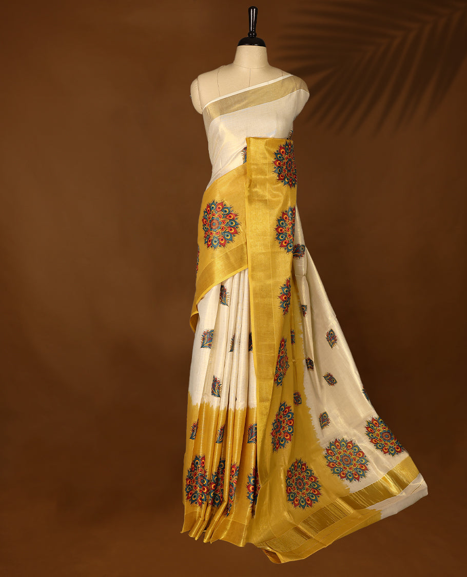 Mustard & Light Gold colour Tissue Kerala saree featuring Bold Floral Printed body and traditional golden zari kasavu border offering a classic and graceful look, paired with a matching blouse.