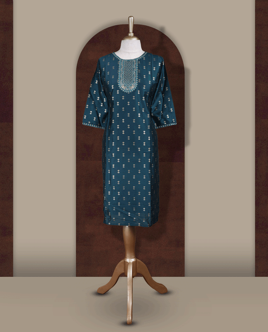 Dark peacock green colour kurti from TWARA, featuring intricate golden foil prints all over and elegant embroidery on the neckline, finished with a round neck and elbow length sleeves.