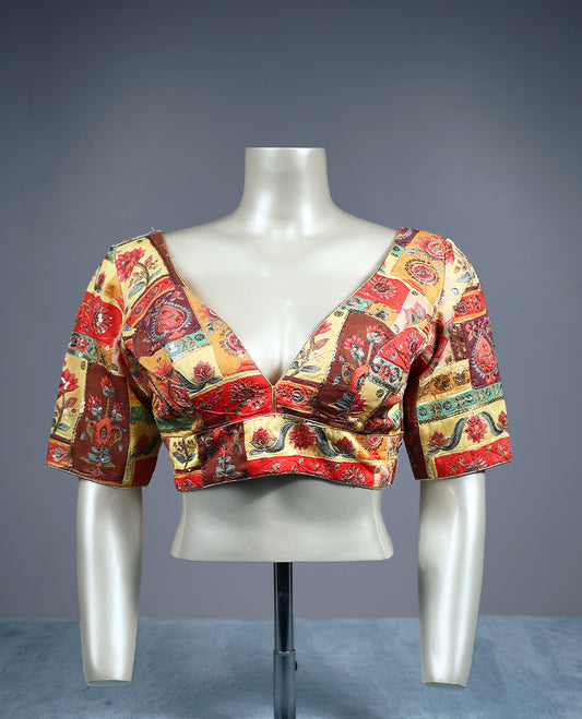 Multicolour, deep V neckline and 2/4th sleeves, adorned with vibrant Kalamkari style patchwork design, padded readymade blouse.