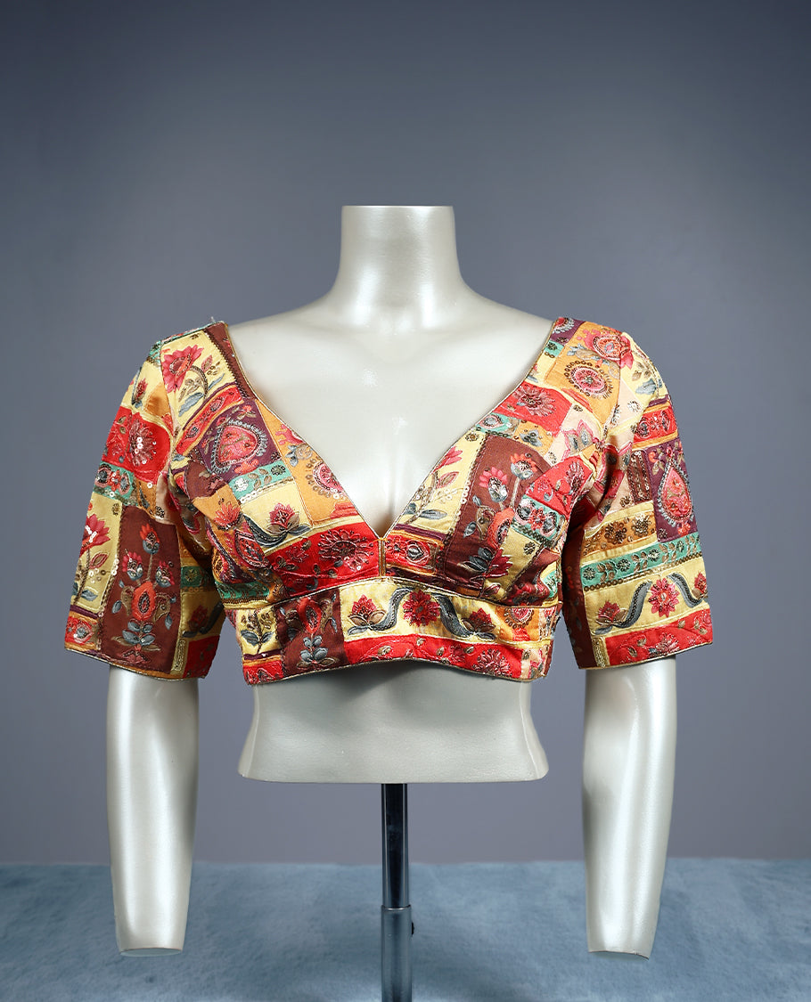 Multicolour, deep V neckline and 2/4th sleeves, adorned with vibrant Kalamkari style patchwork design, padded readymade blouse.