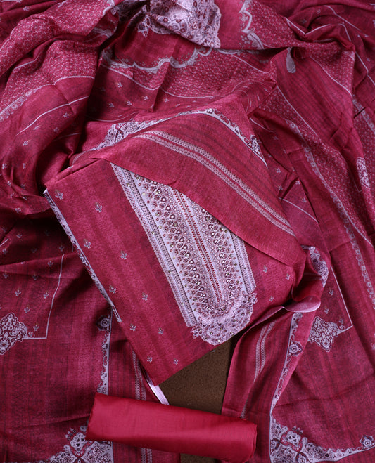 Light maroon colour churidhar material featuring delicate printed patterns with stone highlights, paired with a plain matching bottom and coordinating dupatta.