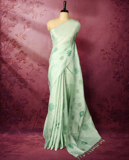 Pastel sea green colour pure tussar silk lightweight saree with self colour floral kodi embroidery and tissue fabric applique work on the body, scallop embroidery worked border, with matching self colour plain blouse