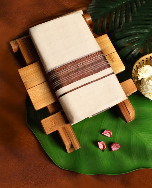 Off white colour pure handloom cotton double dhoti adorned with a rich brown woven kara in intricate patterns, crafted for traditional elegance, cultural pride, and all day comfort