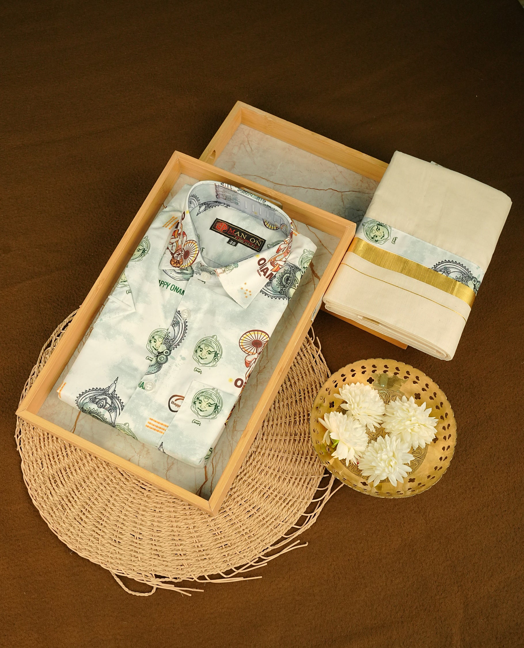 Cream colour shirt featuring  Indian art from printed body, paired with cream colour double dhoti featuring a gold kara with Same printed border.