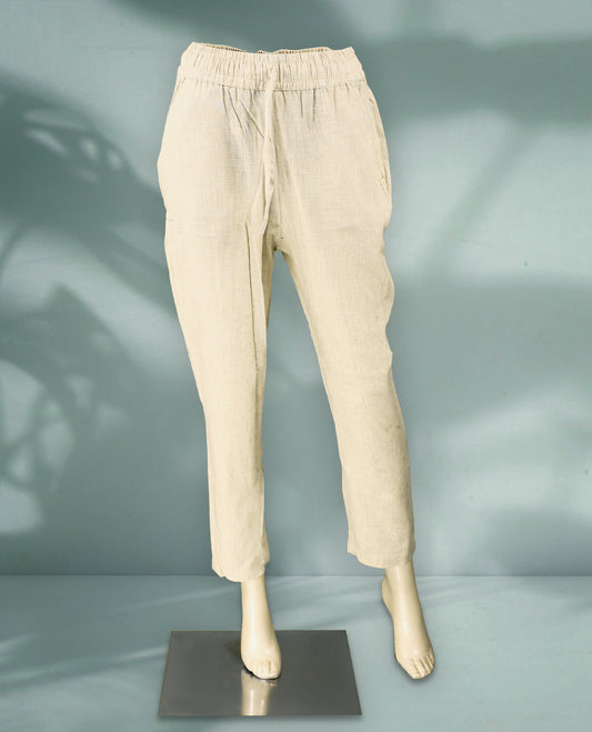 Beige Colour women's pants feature a lightweight, textured fabric with an elastic drawstring waistband and tapered ankle length fit
